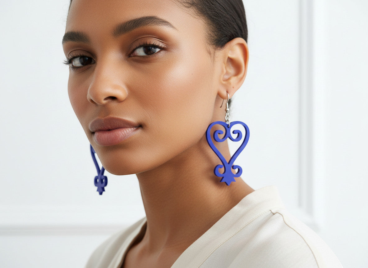 Rejecting Retail Studio blue acrylic Sankofa earrings with hypoallergenic ear wires. Handmade Afrocentric statement jewelry.