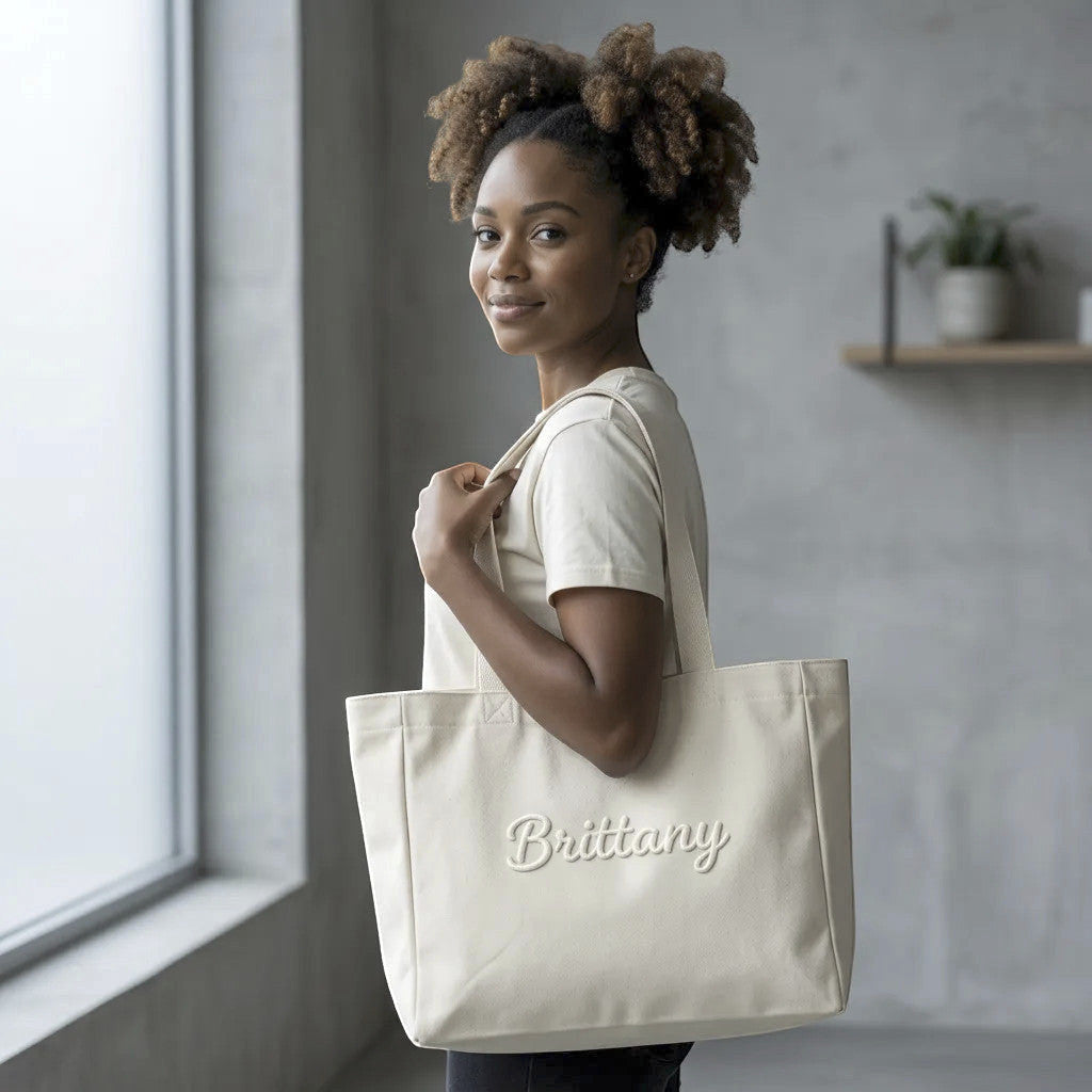Rejecting Retail Studio cream canvas tote bag with 3D puff embroidered custom name "Brittany".