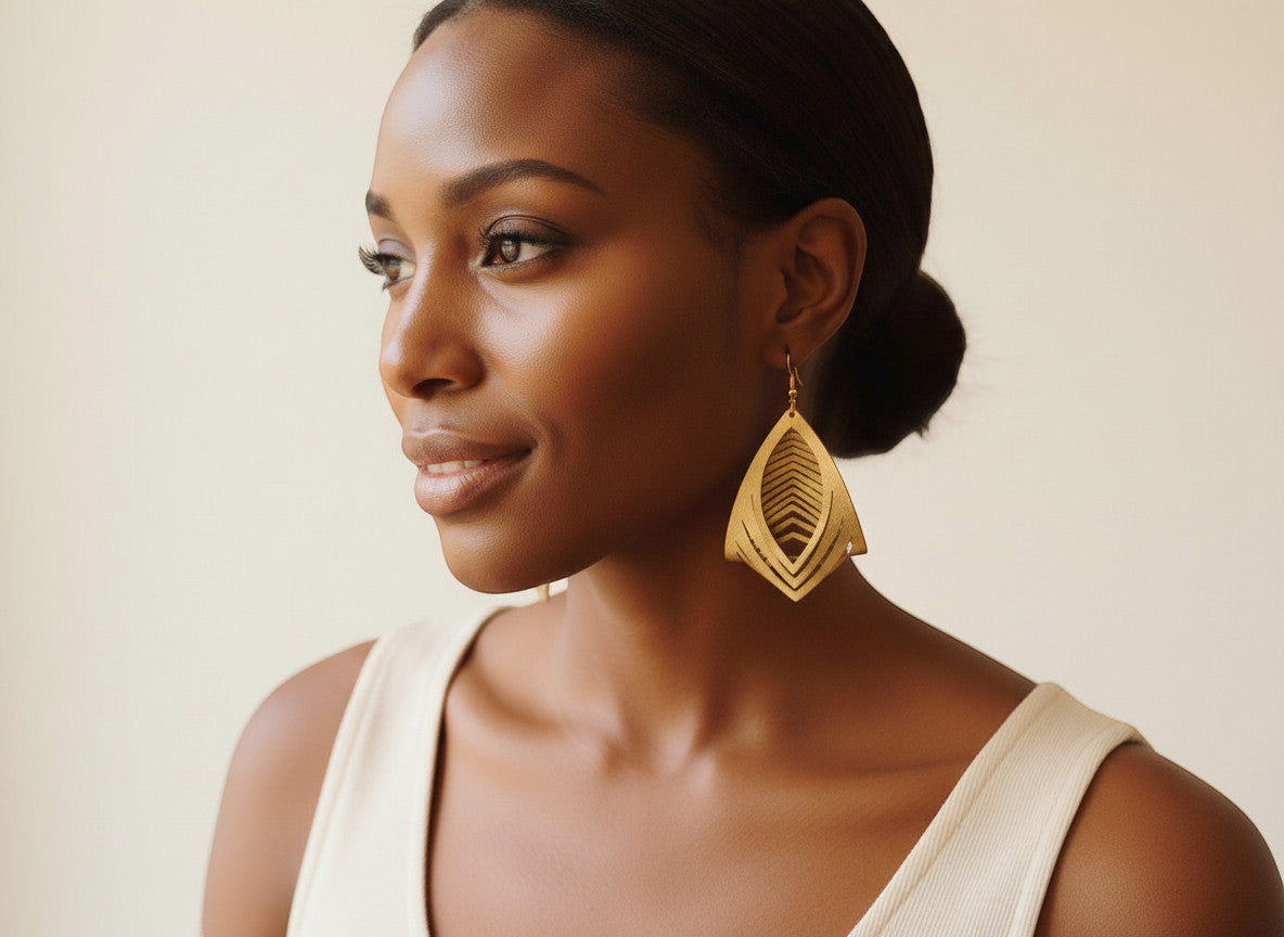 Rejecting Retail Studio hand-painted gold leather statement earrings, 3D sculpted genuine leather, geometric cutout design.
