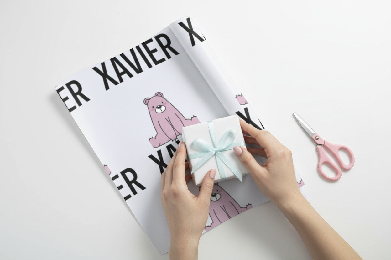 Rejecting Retail Studio personalized wrapping paper with pink bears and custom name "XAVIER" printed in black.