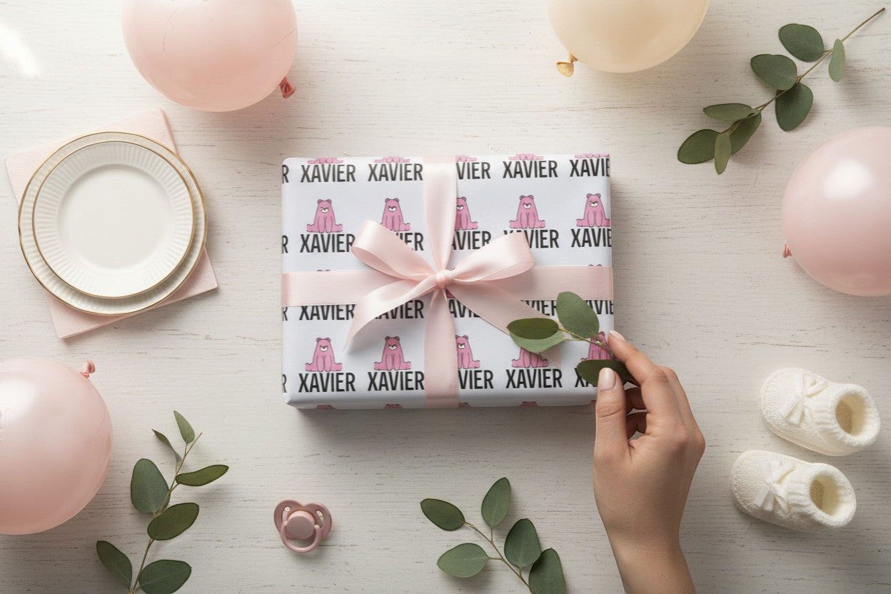 Rejecting Retail Studio personalized pink bear wrapping paper with custom name "XAVIER" printed throughout.