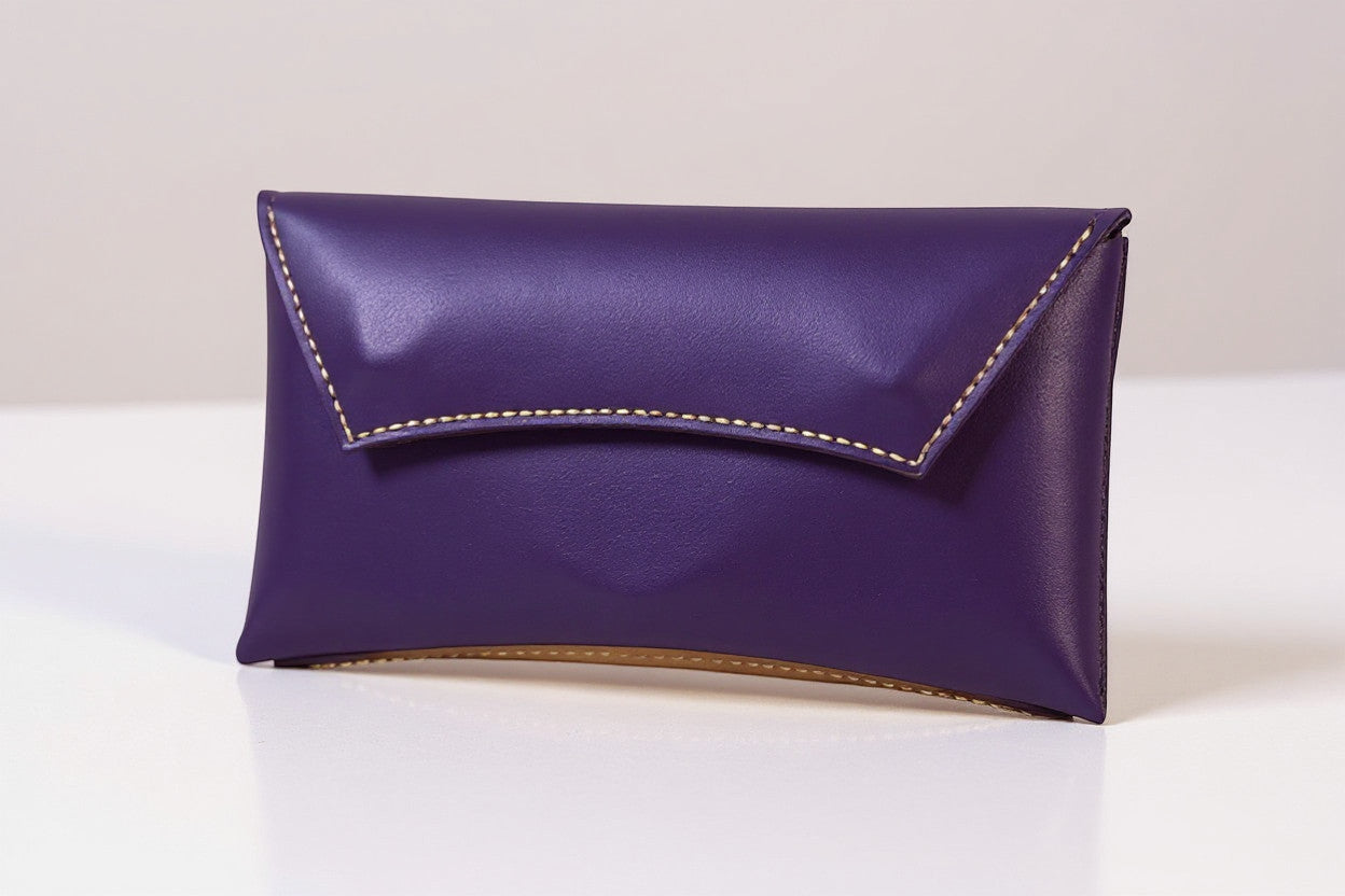 Rejecting Retail Studio handmade purple and orange genuine leather wristlet wallet with magnetic snap closure.