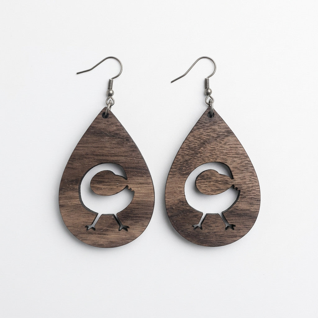 Rejecting Retail Studio Sankofa symbol teardrop walnut wood earrings. Laser-carved artisan jewelry.