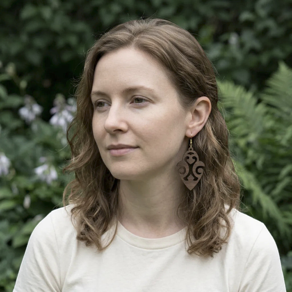 Rejecting Retail Studio walnut wood dangle earrings with ethnic cutout design. Lightweight, hypoallergenic.