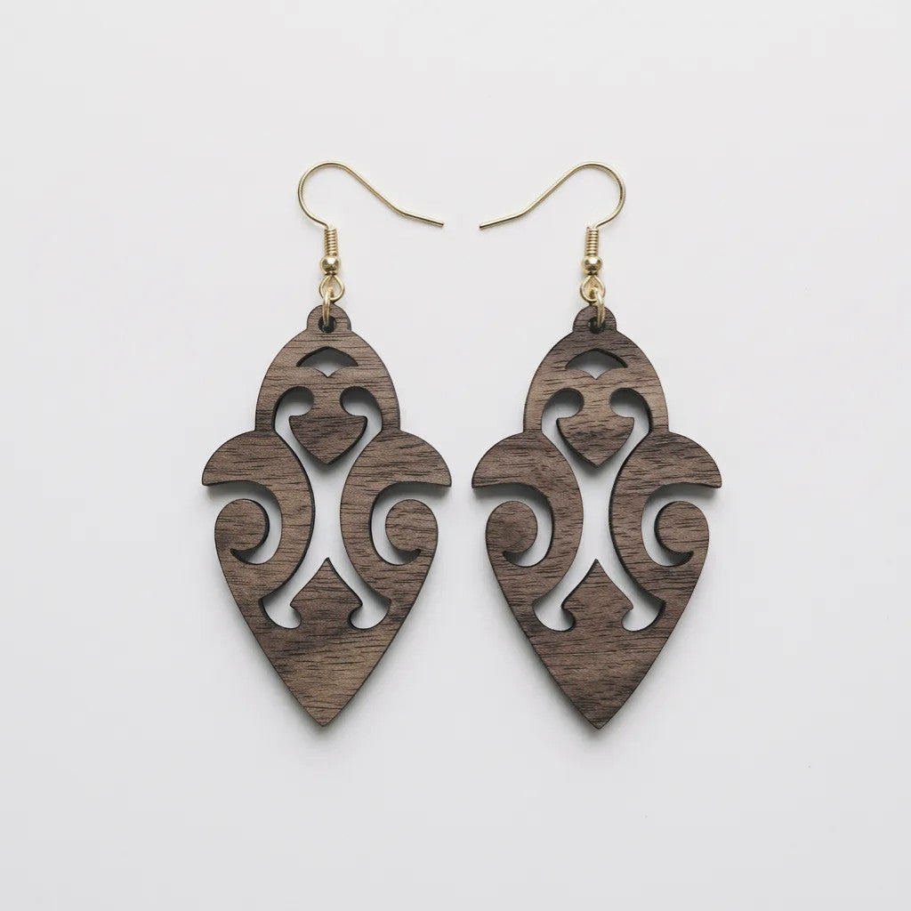 Rejecting Retail Studio walnut wood dangle earrings with ethnic cutout design and hypoallergenic ear wires.