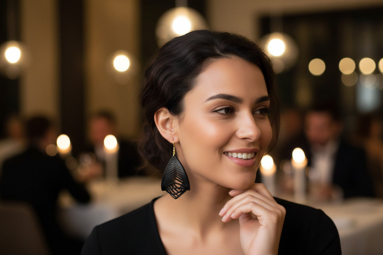 Rejecting Retail Studio hand-painted black genuine leather statement earrings with gold accents and 3D sculpted design.