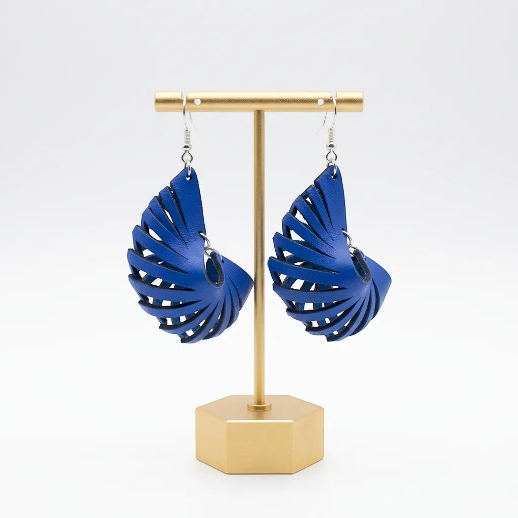 Rejecting Retail Studio blue genuine leather laser-cut 3D sculpted statement earrings. Lightweight, hypoallergenic.