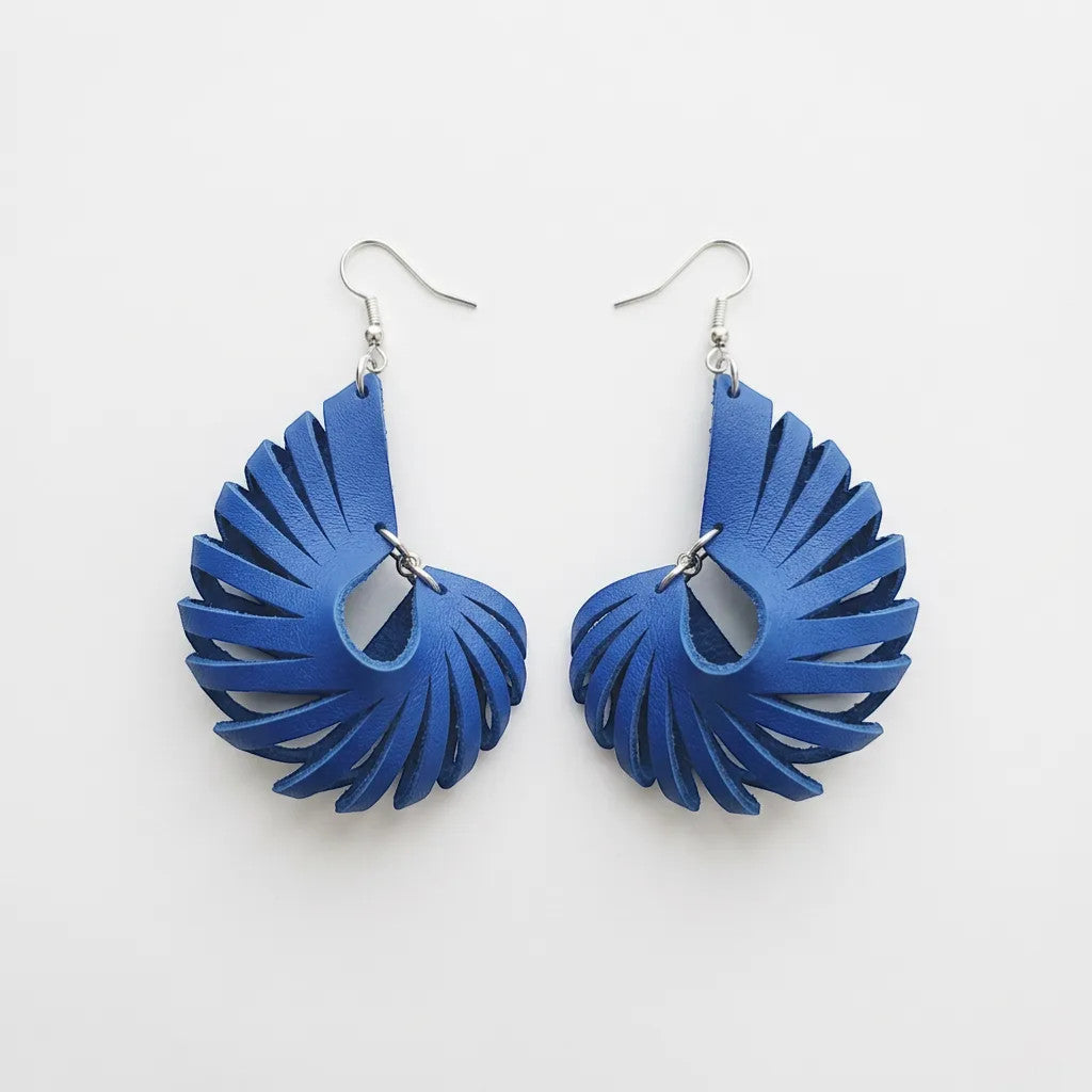 Rejecting Retail Studio cobalt blue genuine leather laser-cut 3D sculpted statement earrings with hypoallergenic ear wires.