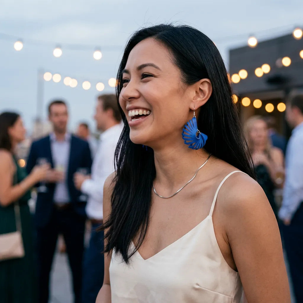 Rejecting Retail Studio cobalt blue genuine leather laser-cut 3D sculpted statement earrings.