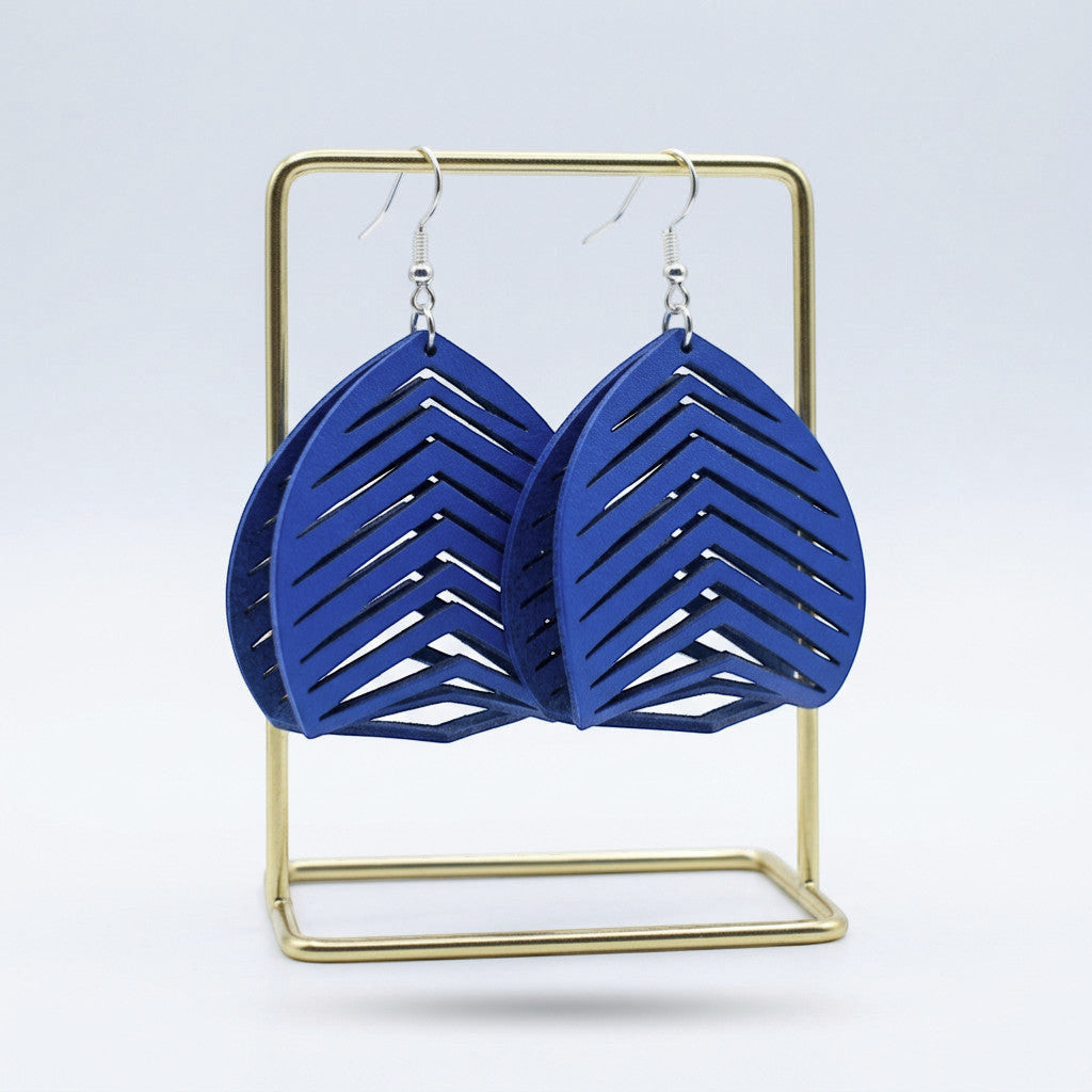 Rejecting Retail Studio large blue genuine leather statement earrings with chevron cutouts and hypoallergenic ear wires.