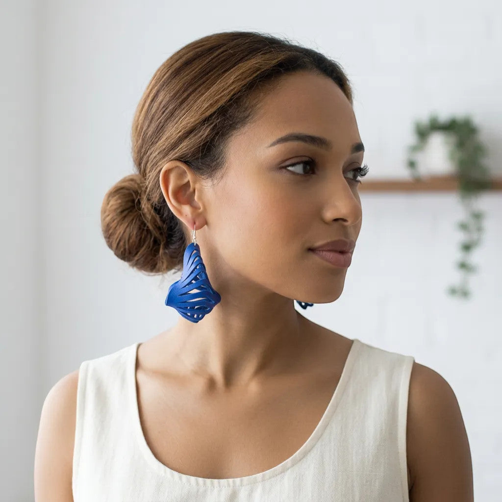 Rejecting Retail Studio cobalt blue genuine leather 3D sculpted laser-cut statement earrings.
