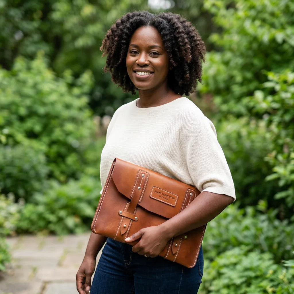 Rejecting Retail Studio hand-sewn brown leather portfolio personalized with name, functions as document holder and laptop sleeve.