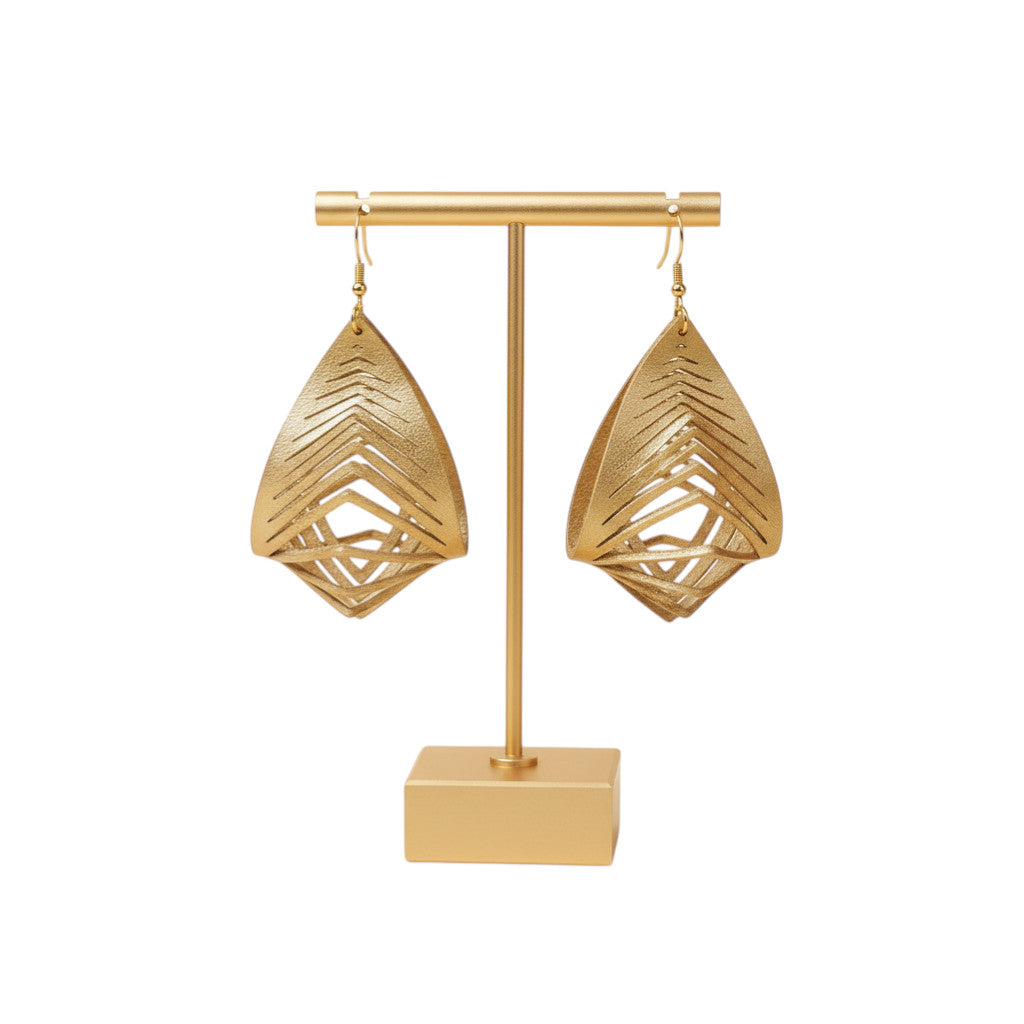 Rejecting Retail Studio gold 3D sculpted genuine leather statement earrings with chevron cutouts.