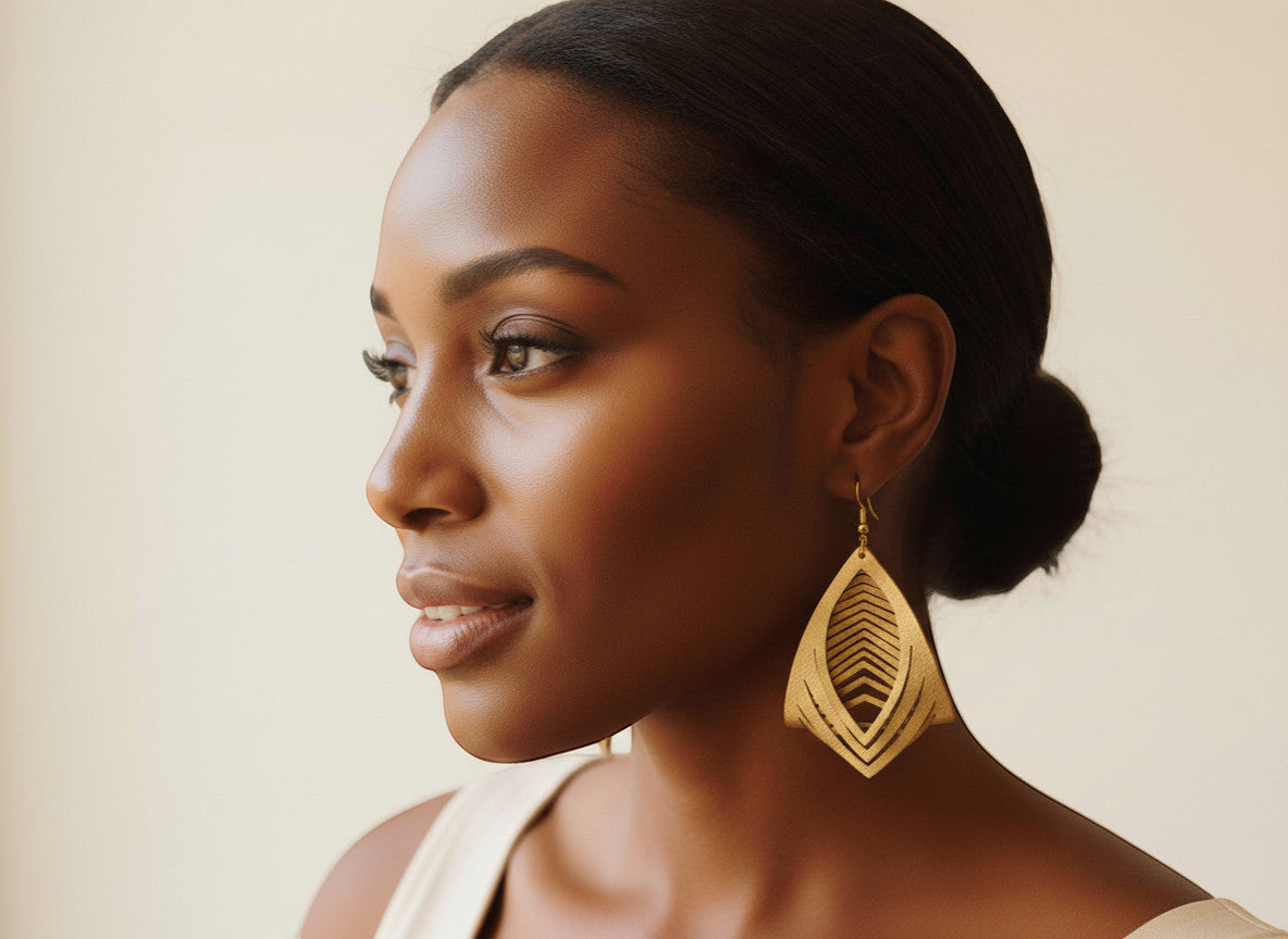Rejecting Retail Studio hand-painted gold genuine leather statement earrings, 3D sculpted design.