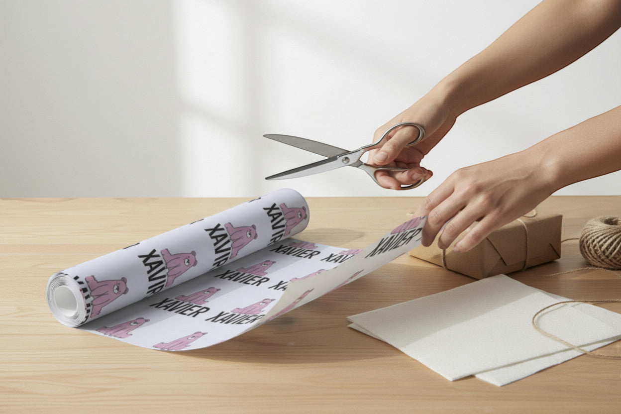 Rejecting Retail Studio personalized light purple wrapping paper with repeating pink bear illustrations and the name "Xavier" integrated into the design.
