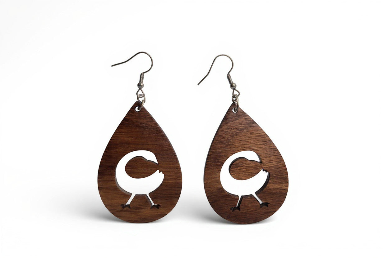 Rejecting Retail Studio Sankofa symbol teardrop walnut wood earrings with hypoallergenic ear wires.