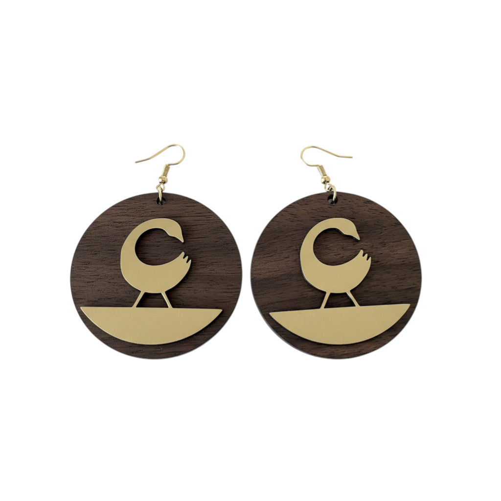 Rejecting Retail Studio walnut wood and gold Sankofa bird earrings with leather accent. Round, mixed-media dangle earrings.