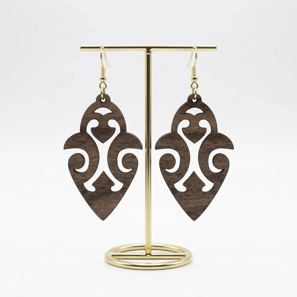 Rejecting Retail Studio walnut wood dangle earrings with ethnic cutout design. Lightweight and hypoallergenic.